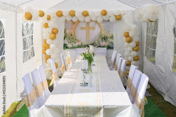 Fototapeta Garden tent for a communion party with a table and white decorations.