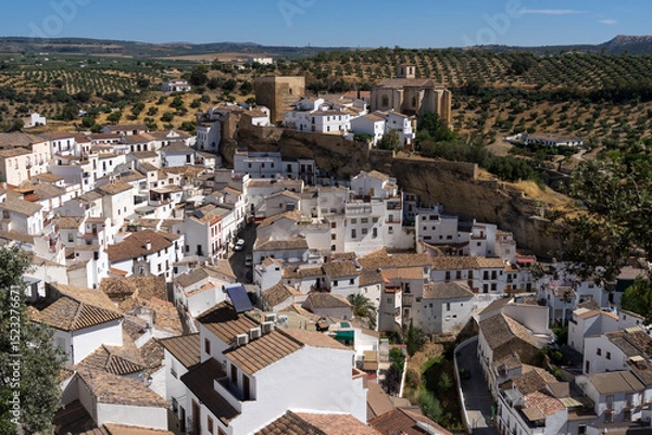 Fototapeta Panoramic view of the beautiful white village of Setenil de las Bodegas since lookout in Cadiz, Spain, with the church and castle in a sunny day.