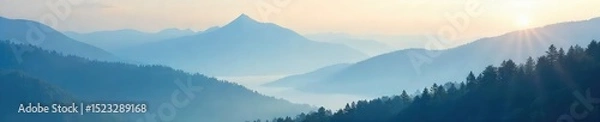 Obraz Misty mountain peaks shrouded in a thick layer of fog, creating an ethereal and mysterious atmosphere Sunlight filters through the clouds, illuminating the treetops below , vibrant, fog