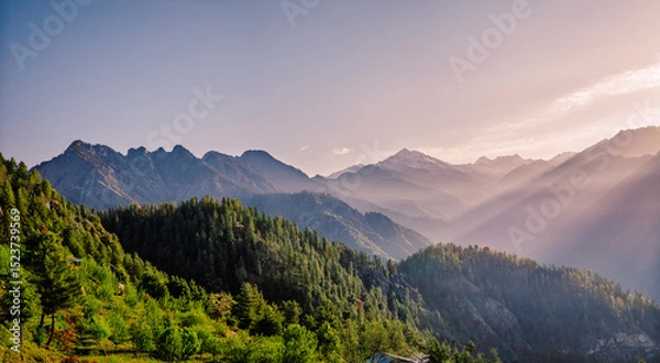Obraz Mountain landscape with fog.  At 6,900 feet,  serene meadows, pine forests, and proximity to the Great Himalayan National Park, Sainj Valley of Kullu District, Himachal Pradesh, India.