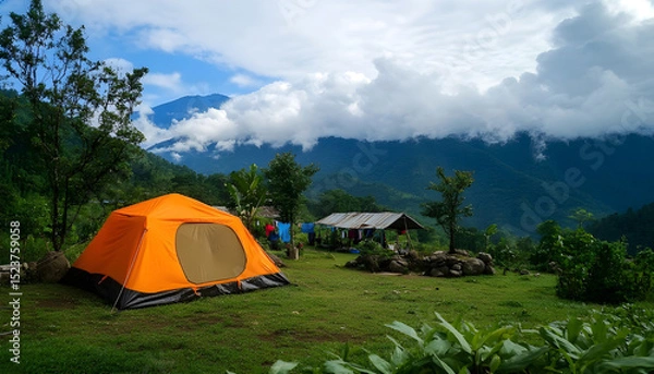 Obraz Tourist camp in the mountains, tent in the foreground