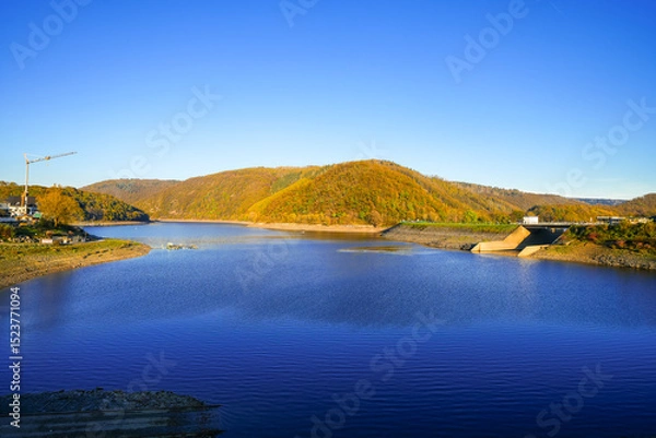 Obraz View of the autumn landscape at Eiserbachsee in Rurberg. Idyllic nature at the Eifel Rursee in the Volcanic Eifel region of Rhineland-Palatinate.
