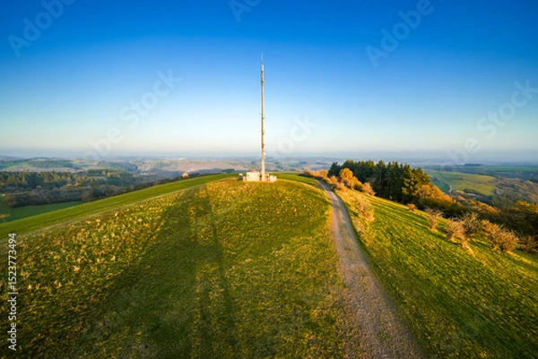 Obraz View of the landscape at the Meerfelder Maar. Nature at the crater lake in the Volcanic Eifel National Park. The surrounding area near Meerfeld at sunset in the evening.

