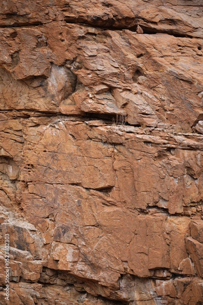 Fototapeta Lines and textures in rocks of mountain cliff