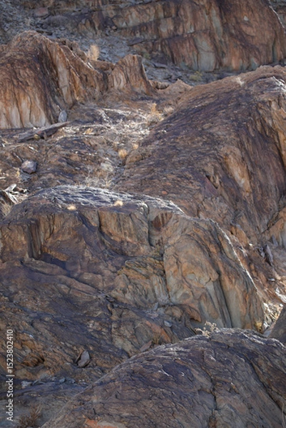 Fototapeta Lines and textures in rocks of mountain cliff