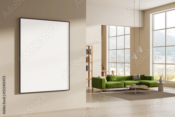 Fototapeta Blank poster mockup hanging on beige wall in stylish modern interior with green sofa and large windows in bright daylight setting. 3D Rendering