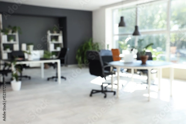 Obraz Blurred view of modern office with desks, shelf units and green plants