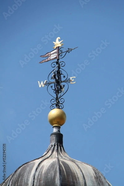 Obraz An Ornamental Wind Vane on a Bright Sunny Day.