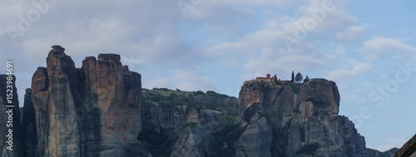 Fototapeta Panoramic view of landscape of Meteora rock formations with St. Stephan Monastery on top of the rocks during sunset, Kalambaka, Thessaly, Greece
