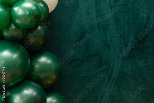 Fototapeta Elegant green and dark green balloons on a textured dark emerald green background. Perfect for celebrations, parties, or design backdrops with a luxurious feel.