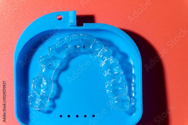 Obraz Transparent aligners and storage case. Invisible braces. Clear teeth straighteners. plastic bracers ready to use