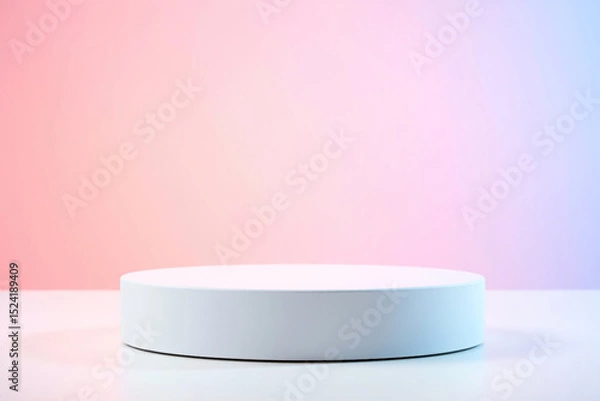Fototapeta White cylindrical display platform against a pastel pink and blue gradient background