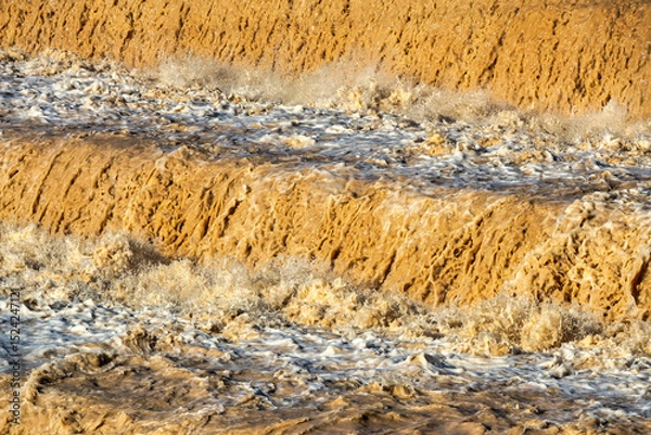 Fototapeta Muddy Waterfall in Flood Season with Powerful Flow