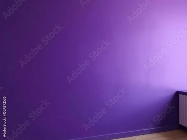 Fototapeta A solid purple wall in a modern interior setting. The wall is smooth and vibrant, with a wooden floor visible at the bottom. A radiator is positioned against the wall.