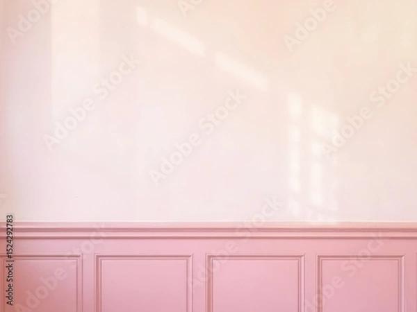 Fototapeta Empty interior wall with soft natural light and pink wainscoting, suitable for mockup or design presentation in a room setting.