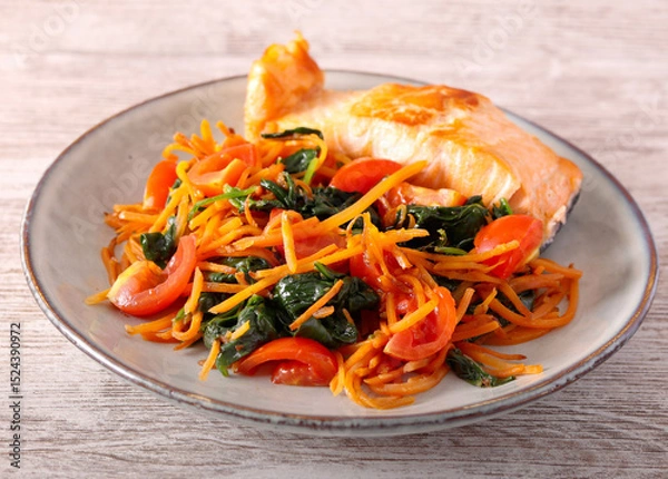 Fototapeta Salmon with carrot and spinach on plate