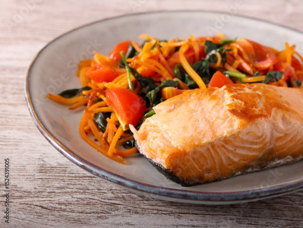 Fototapeta Salmon with carrot and spinach on plate