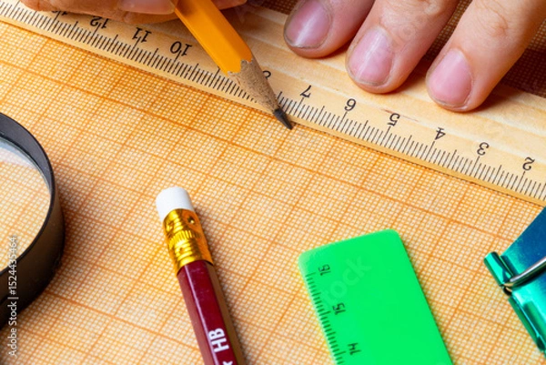 Obraz draftsman draws on a ruler