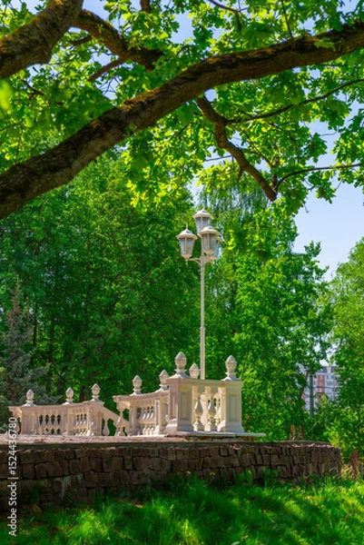 Obraz An old architectural detail made of white concrete with a street lamp