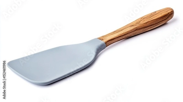 Fototapeta A light grey silicone spatula with a light brown olive wood handle, isolated on a white background.  The spatula has a slightly curved, broad head and a comfortable-looking grip