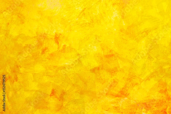 Fototapeta The texture of the wall with the chipped old antique plaster. Abstract background painted in Golden yellow