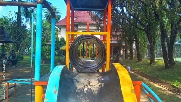 Fototapeta playground slide designed for children's outdoor recreation, suitable for parks and schoolyards.