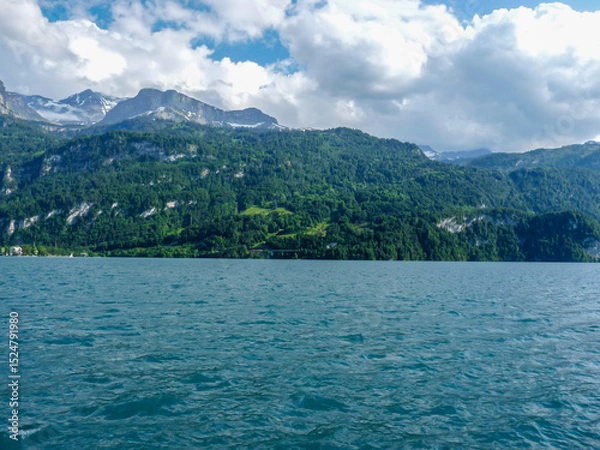 Obraz Switzerland, Meiringen, a large body of water with a mountain in the background