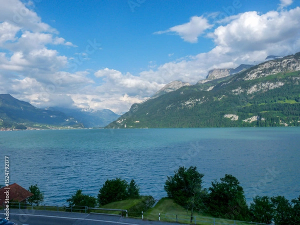 Obraz Switzerland, Meiringen, a body of water with a mountain in the background