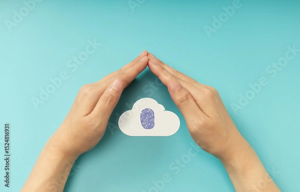 Fototapeta Hands shielding Fingerprint on Cloud symbol, representing Cybersecurity, data privacy, and online protection. Top View