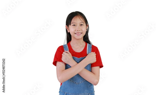 Obraz Portrait of Asian preteen girl crossed hands posture on chest isolated on white background. Happy kid show arms x sign and looking camera.