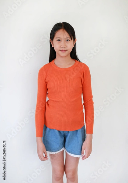 Obraz Portrait of Asian girl child age 10-11 years old standing on white studio background.