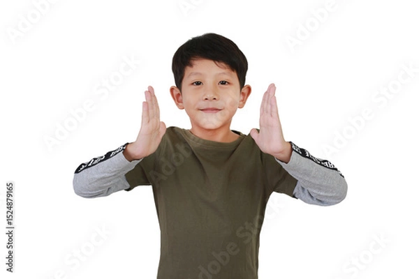 Obraz Portrait cheerful Asian little boy kid making hands between something empty space isolated on white studio background. Advertising, product and promotion ideas concept.