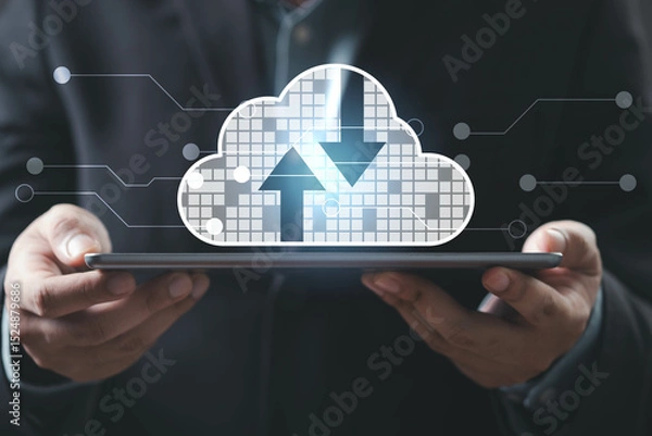 Fototapeta A person holds a tablet displaying a cloud symbol with upload and download arrows, representing cloud computing and data management.
