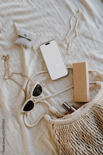 Fototapeta Flat Lay with Smartphone and Accessories on Beige Fabric, Simple Earthy Tones