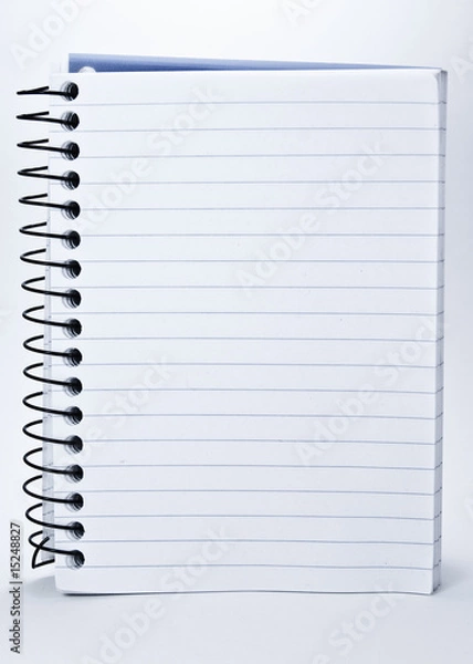 Fototapeta Notepad with spiral binding and white, lined pages.