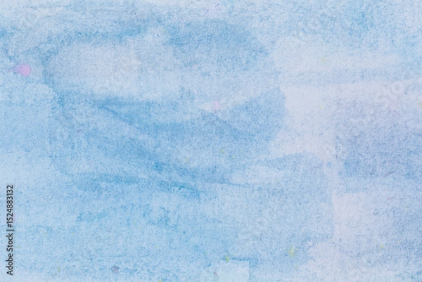 Fototapeta Macro close-up of hand painted light blue watercolor background with watercolour stains and brush strokes. High resolution full frame textured paper background with copy space.