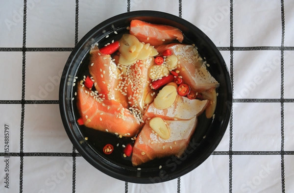 Obraz Pickled salmon Korean soy sauce marinated Korean food on table. Top view.