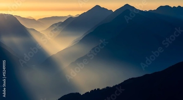 Fototapeta Mountain Range and Sunlight in Hazy Landscape
