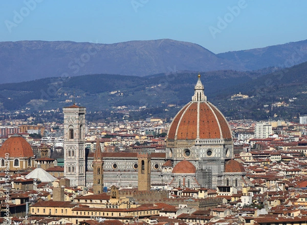Fototapeta view of florence duomo in central italy with famous giotto bell tower and brunelleschi designed dome and apennine hills in background