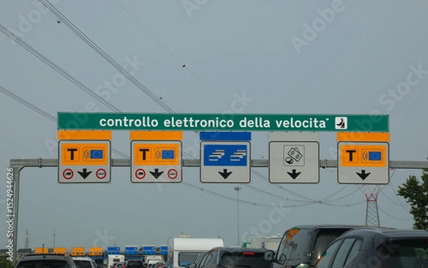Fototapeta cars in the italian motorway and gate with text that means electronic speed  control