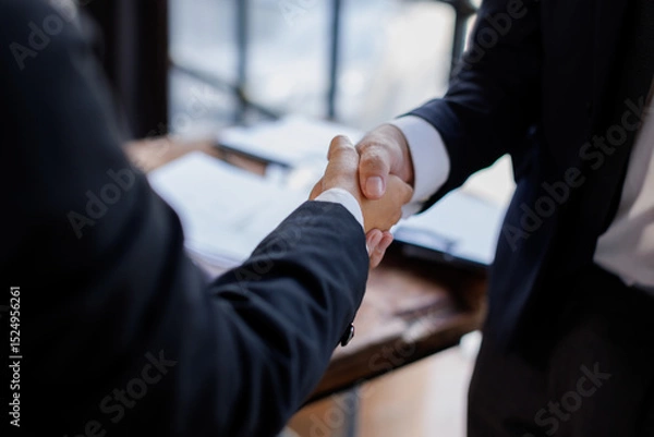 Obraz Happy business asian manager handshaking client at meeting. Smiling female hr hiring recruit at job interview, insurance agent, lawyer making contract deal at work with business handshake.