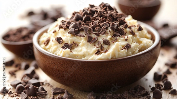 Obraz Creamy dessert with chocolate chips in bowl on table, blurred background