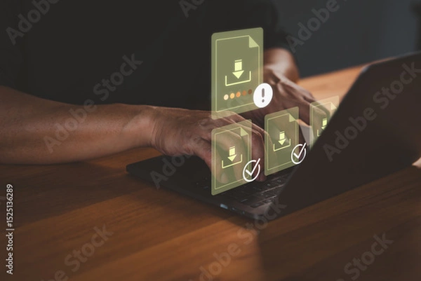 Fototapeta Person using a laptop computer with multiple digital download icons, representing data transfer, cloud storage, file management, digital technology and progress notification system.