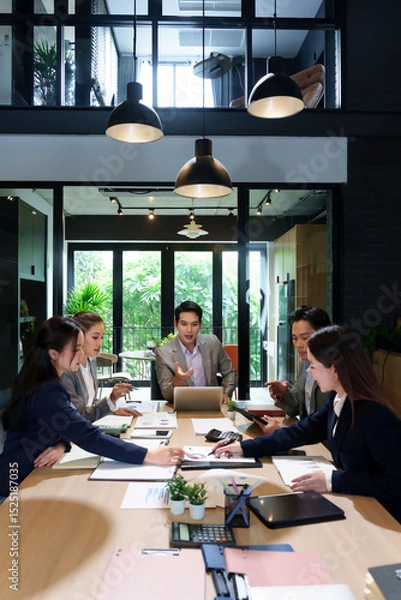 Obraz Business Meeting Collaboration Teamwork in Modern Office Asian Professionals Discussing Strategy Data Analysis Brainstorming Solutions Achieving Goals