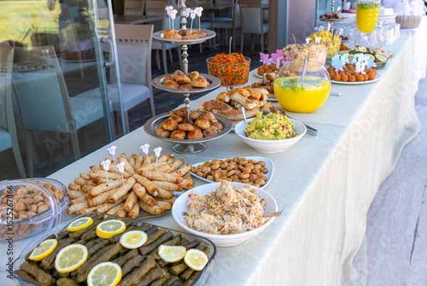 Obraz Outdoor catering buffet with a variety of food snacks and appetizers