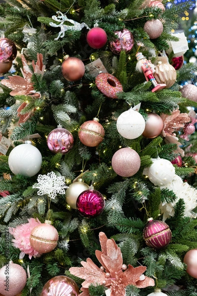 Obraz Festive decorations adorn a beautifully arranged Christmas tree featuring pastel ornaments and twinkling lights inviting joyful holiday spirit