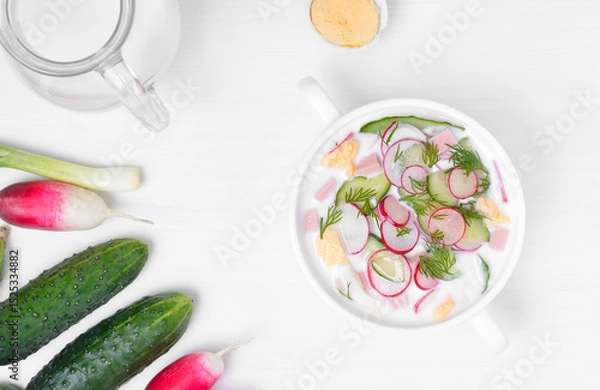 Fototapeta Homemade summer yoghurt cold soup with radish, cucumber, and dill.
