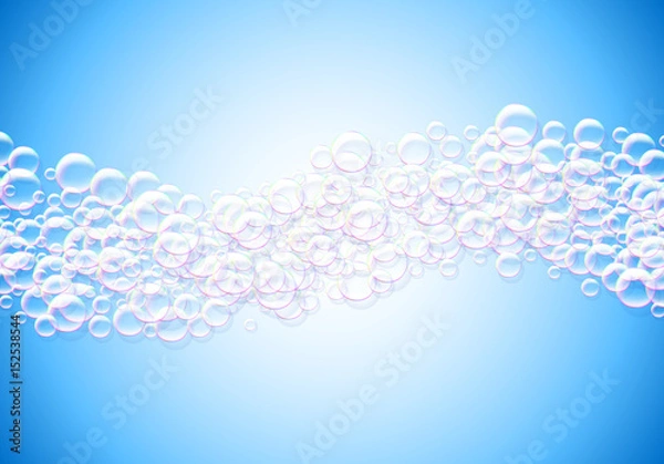 Fototapeta Soap bubbles abstract blue background with rainbow colored airy foam