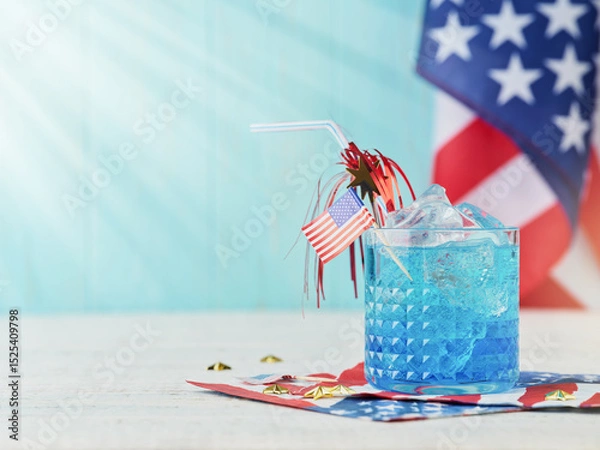 Obraz 4th of July Holiday background. Cocktail with blue liqueur, American flag and festive straw against background of old turquoise board and sun rays. Patriotic American Flag drinks. Mock up.