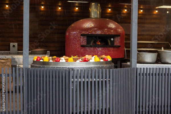 Fototapeta Large frying pan with grilled vegetables. Oven with open fire.
